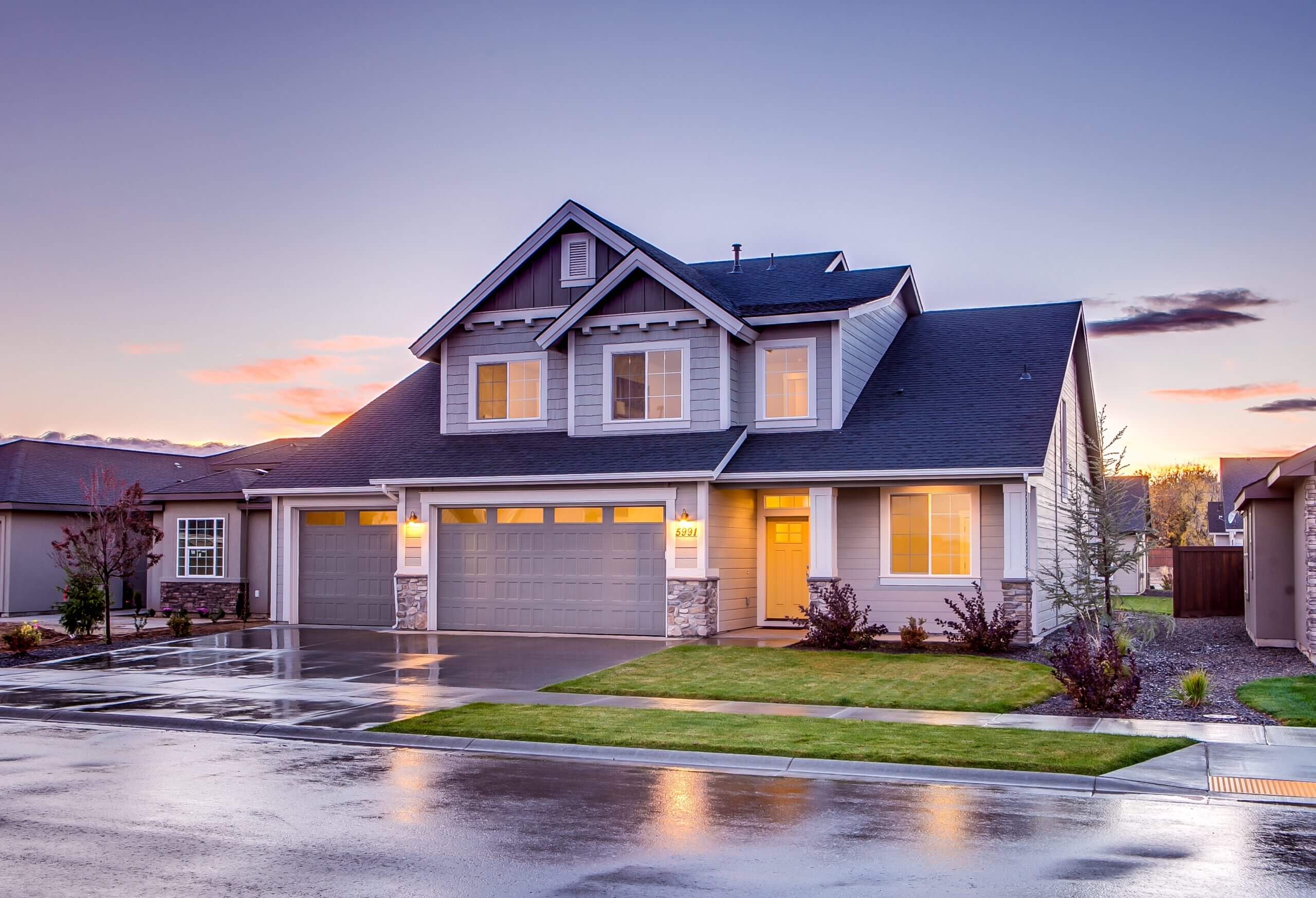 a nice home light up at dusk of day.